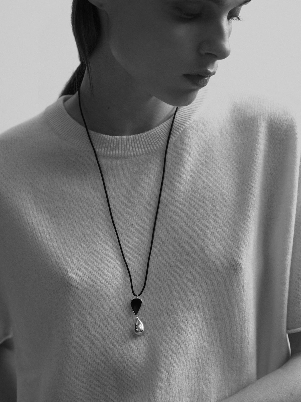 Inti Pendant in Sterling Silver / Black Cord