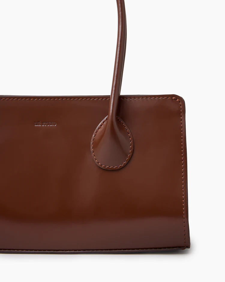 The Lou Bag in Brown Patent Leather